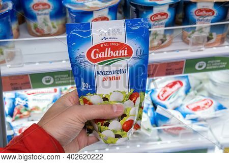 Tyumen, Russia-november 07, 2020: Man Hand Holding Pack With Delicious Galbani Mozzarella At The Sup