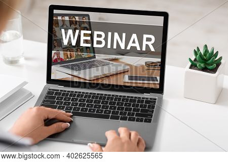 Female Hands On Laptop Keyboard With Webinar Text On Screen, Unrecognizable Woman Sitting At Workdes