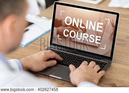 Unrecognizable Caucasian Businessman Or Manager Having Online Course On Laptop, Office Interior, Ove
