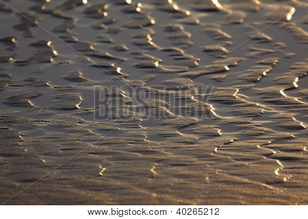 Textura v písku, Valdearenas Beach, Liencres, Kantábrie, Španělsko