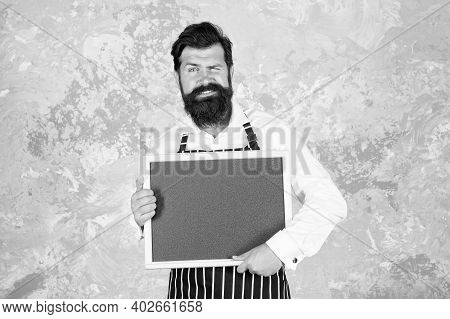 Brutal Man Hipster Hold Blackboard, Copy Space. Coffee To Go. Nicest Price In Town. Bearded Chef Sho