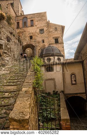 Narrow Cobbled Street Leading To The Castle Of Bolsena, Lazio, Italy