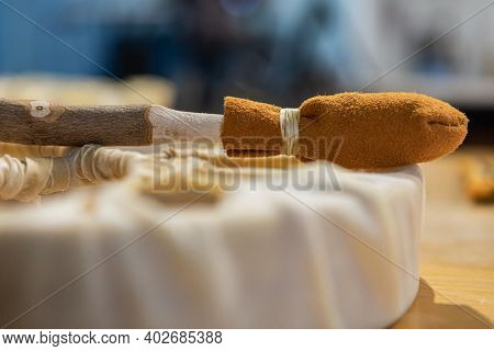 Close Up Shot Of A Recently Finished, Hand Made Drum Stick With Its Head In Soft Leather, Created Du