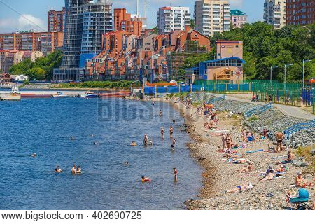 Summer, 2016 - Vladivostok, Russia - Water Area Of Fedorov Bay In Vladivostok. People Swim And Sunba