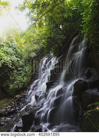 Long Exposure Panorama Of Tropical Air Terjun Kanto Lampo Waterfall Cascade Natural Rock Steps In Gi
