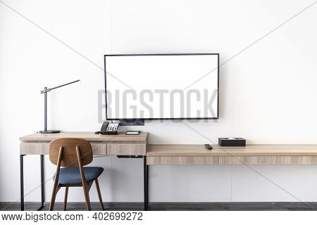 Living Room Interior Led Tv Stand On White Wall Mounted With Wooden Table In The Room In A Modern St