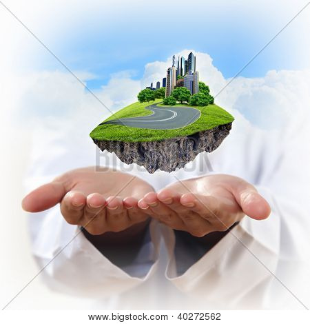 Immagine di un paesaggio urbano moderno nella mano di un uomo d'affari