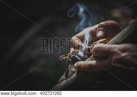 Drug Addicts In The Dark Room. Addict/junkie Preparing Drugs With A Spoon And Lighter. White Powder 