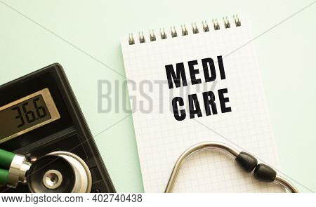 Notepad With Text Medi Care, Calculator And Stethoscope On White Background. Medical Concept.