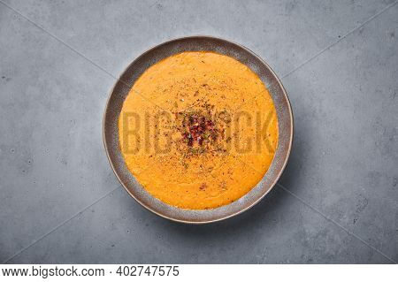 Ezogelin Soup In Gray Bowl On Concrete Table Top. Turkish Cuisine Traditional Dish With Red Lentils,