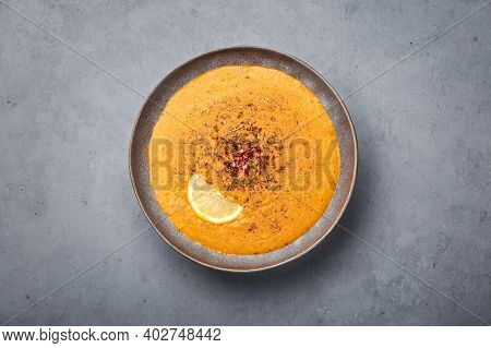Ezogelin Soup In Gray Bowl On Concrete Table Top. Turkish Cuisine Traditional Dish With Red Lentils,