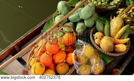 Iconic Asian Lat Mayom Floating Market. Khlong River Canal, Long-tail Boat With Tropical Exotic Colo