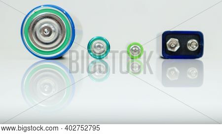 Battery Type D Or C, Pp3, Aa, Aaa On A White Background With Reflection. View Of Metal Alkaline Batt