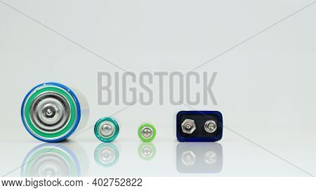 Battery Type D Or C, Pp3, Aa, Aaa On A White Background With Reflection. View Of Metal Alkaline Batt