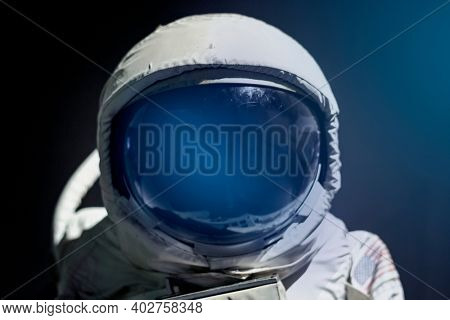 Spacesuit helmet visor close up on astronaut