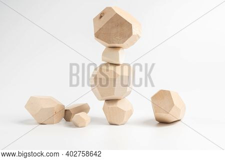 Tumi-ishi Puzzle Game. Construction Of An Unstable Wooden Block Tower. The Process Of The Game. Ston