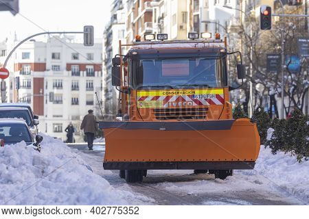 Madrid, Spain - January 10, 2021: Snow Plow Public Service Truck Vehicle Working, On A Snowy Day, Du