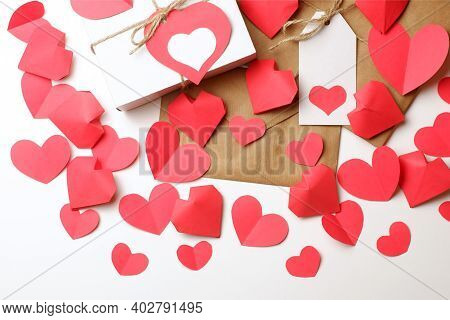 White Gift Box With Red Label In A Heart Form, Gift Wrapped In Brown Craft Paper, Tied With Twine Wi