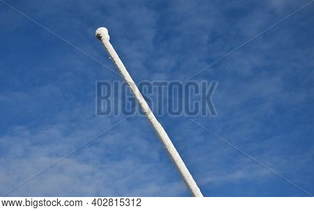 Power Lines Frozen By A Large Layer Of Ice In The Shape Of A Cylinder With Icicles. Icing Loads The 