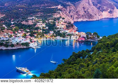 Kefalonia, Greece. Colorful Village Of Assos Seen From Assos Castle.