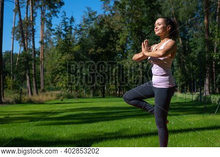Yoga Balance Vriksha-asana The Tree Pose. Performing Yoga Outdoor