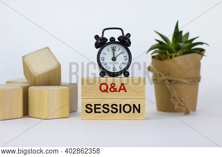 Q And A, Questions And Answers Session Symbol. Concept Words 'q And A Session' On Wooden Blocks On A