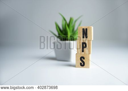 The Text Nps Net Promoter Score On Wooden Cubes. Business Concepts