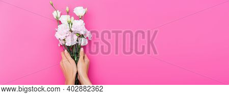 Cropped View Of Woman With Pastel Nails Holding Carnation And Eustoma Flowers On Pink Background, Ba