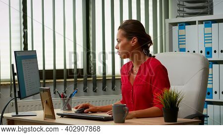 Hispanic Lady Working In Modern Office Early In The Morning. Entrepreneur Comming At Work, In Profes