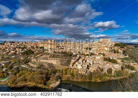 Toledo, Spain. Old City With Its Alcazar, Royal Palace Over The Tagus River Sinuosity. Spain, Europe