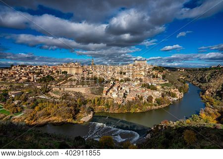 Toledo, Spain. Old City With Its Alcazar, Royal Palace Over The Tagus River Sinuosity. Spain, Europe