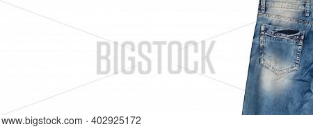 Back Pocket And Waist Area Of Light Blue Jeans With Faded White Spots, Isolated On White Background.