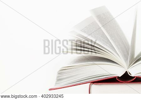 Open Pages Book On Stack Of Books Isolated On White Background With Place For Text