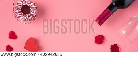 Valentine's Day Dating Gift With Wine And Rose Concept On Pink Background