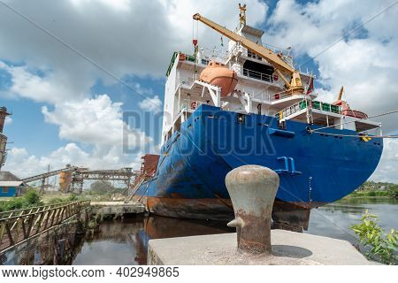 Ship Moored At Pier Under Loading. View From The Aft Stern Prow.