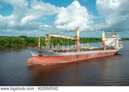 Multipurpose Cargo Ship Underway In The River.