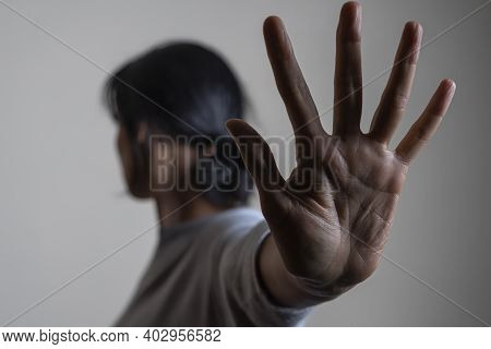 Woman Rises Her Hand Up And Showes Stop Gesture By Hand Trying To Stop Any Coming Danger. Nonverbal 