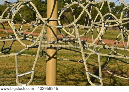 A Closeup Of A Rope-based Climbing Playground Equipment