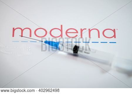 Riga, Latvia: January 12, 2021: Moderna Covid-19 Vaccine Concept. Close-up Of A Syringe And And, The