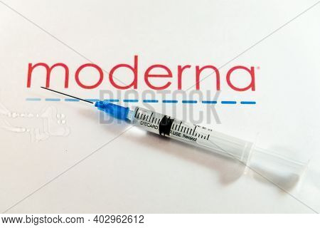 Riga, Latvia: January 12, 2021: Moderna Covid-19 Vaccine Concept. Close-up Of A Syringe And And, The