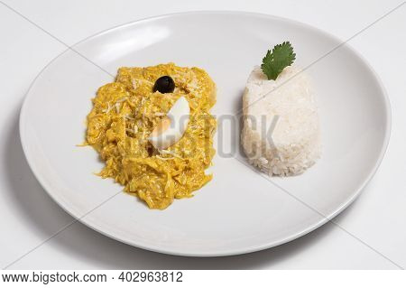 Peruvian Chicken Dish Called Aji De Gallina, Served With Boiled Rice