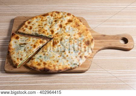 Megruli A Typical Georgian Focaccia Stuffed With Cheese And Meat