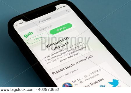 Morgantown, Wv - 12 January 2021: Modern Iphone With Gab Social Media Site Showing Home Page For The