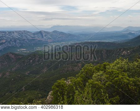 Aerial View Of Green Forest Landscape Of Supramonte Mountains With Limestone Rock And Mediterranean 