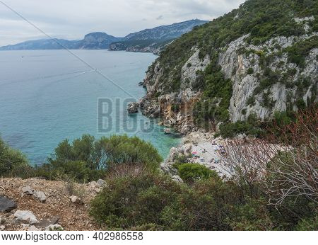 Aerial View Of Cala Fuili Beach Near Cala Gonone, Gulf Of Orosei, Sardinia Island, Italy. White Pebb