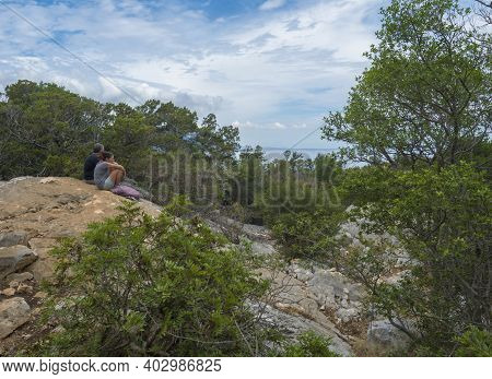 Cala Gonone, Sardinia, Italy, September 8, 2020: Middle Age Couple Enjoying View Over Gulf Of Orosei