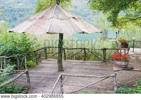 In Nauture , A House With A Wooden Fence. High Quality Photo