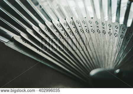 Traditional Black Hand Fand Closeup View. Abstract Background