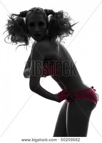 one caucasian sexy woman topless portrait with pink underwear in silhouette studio isolated on white background