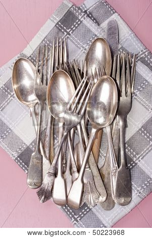Vintage Cutlery On A Kitchen Towel